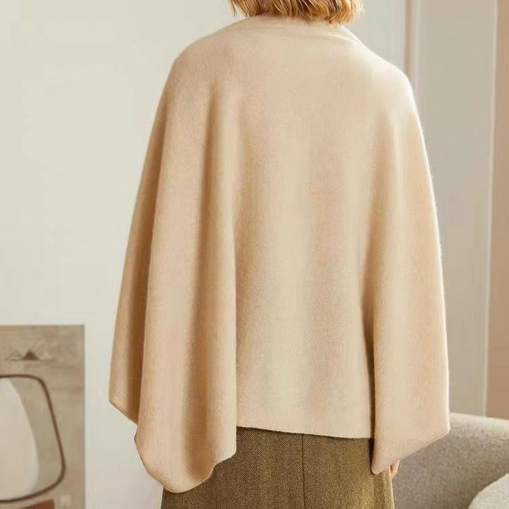 Close-up of elegant knit shawl wrap texture, highlighting its softness and quality.