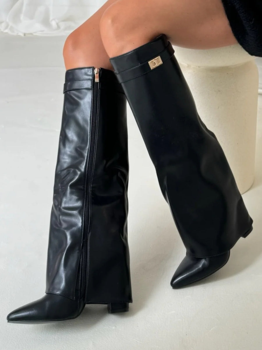 Women's black leather thigh-high boots with metallic buckle hardware, a must-have fashion item.