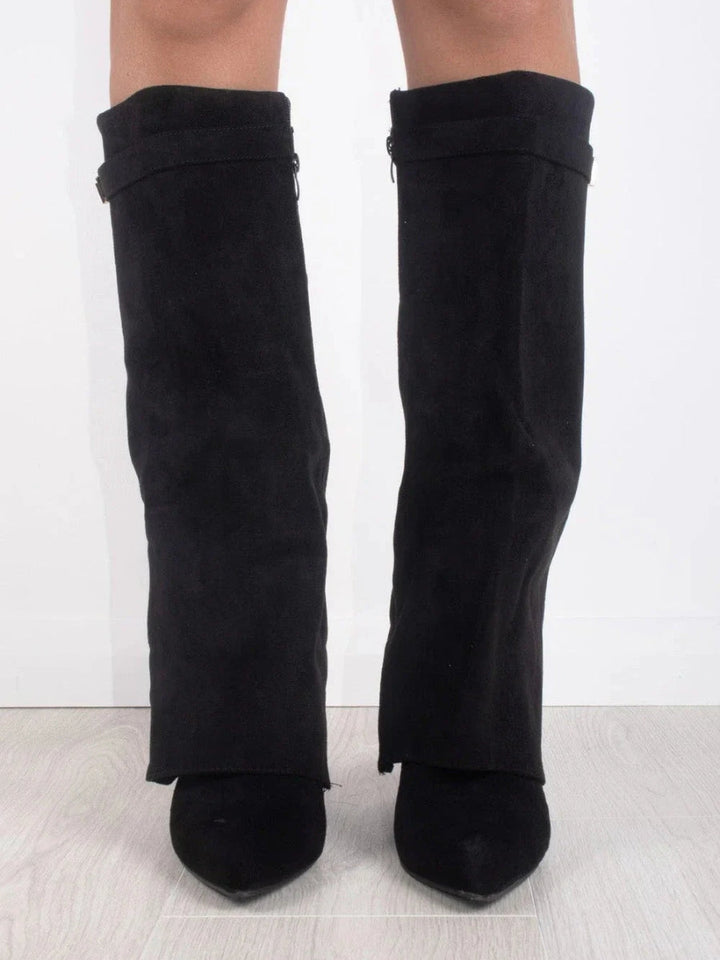 Full shot of women's sophisticated leather thigh-high boots, showcasing their tall, elegant design.
