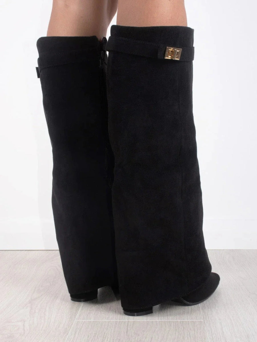 Stylish women's thigh-high boots in premium leather with a striking side buckle accent.