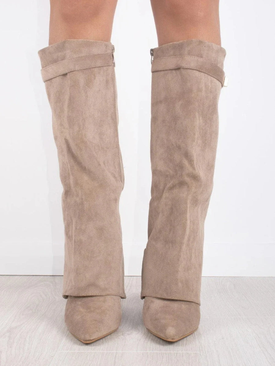 Detailed view of the refined stitching and buckle on these women's leather thigh-high fashion boots.