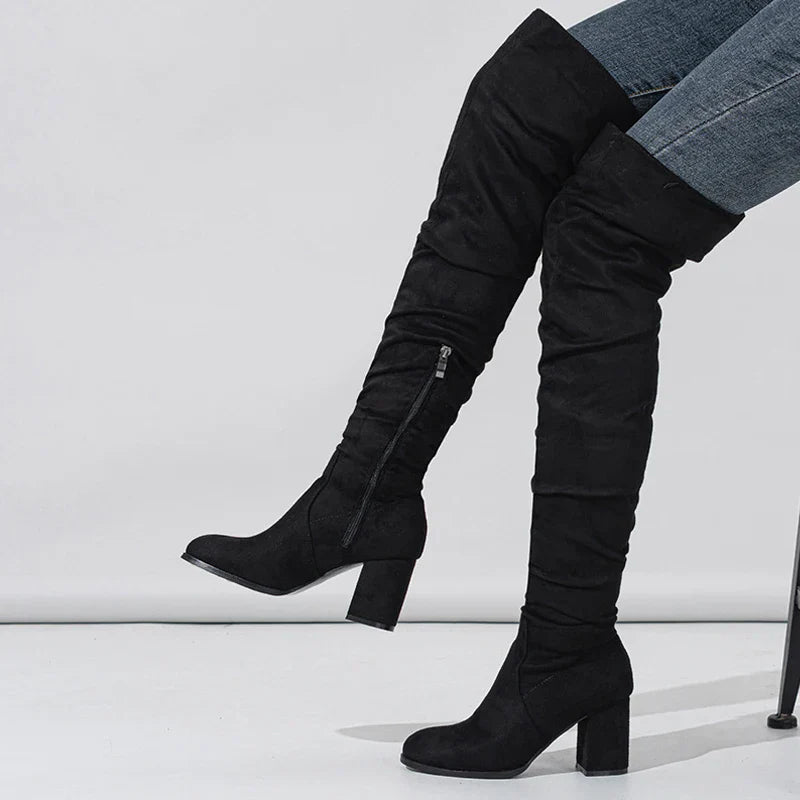 Elegant black over-the-knee heeled boots for women, perfect for a stylish winter look.