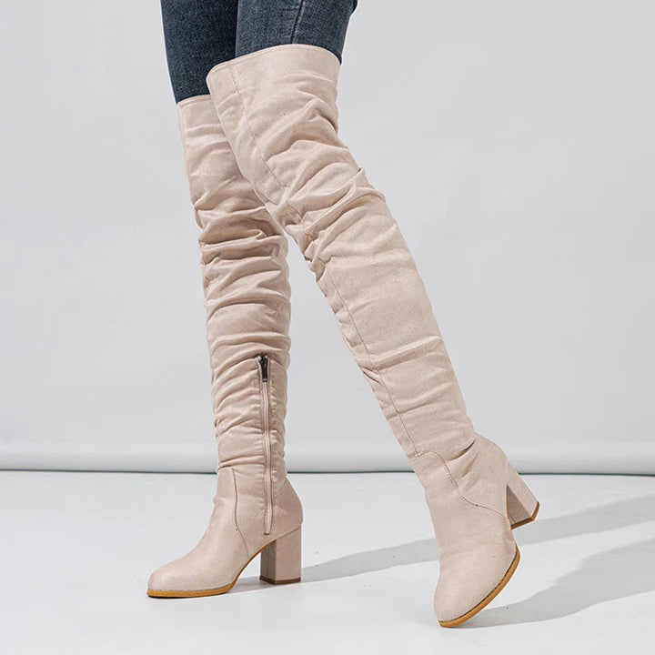 Women's sleek thigh-high boots with a high heel, ideal for fashion-forward party wear.