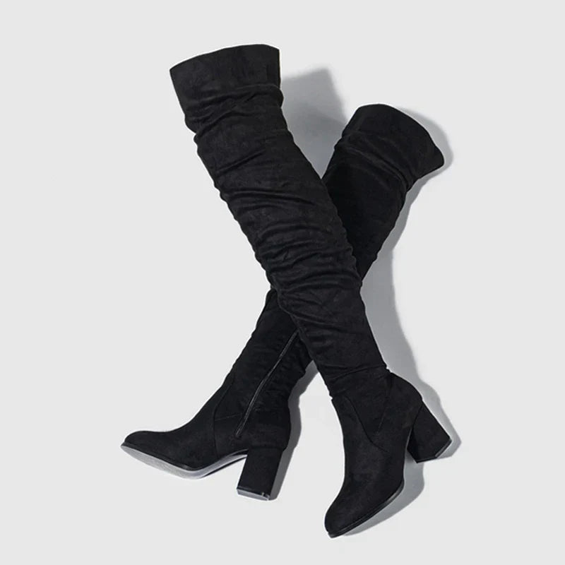 Elegant women's heeled thigh-high boots with a pointed toe, versatile for casual or party wear.