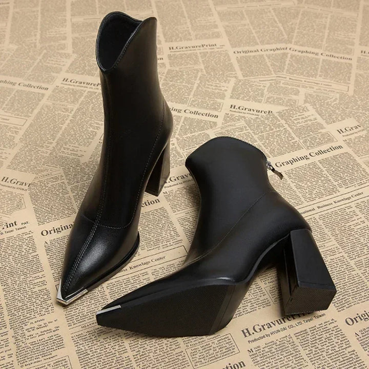 Versatile women's footwear: black pointed heel ankle boots, great for dressing up or casual spring looks.