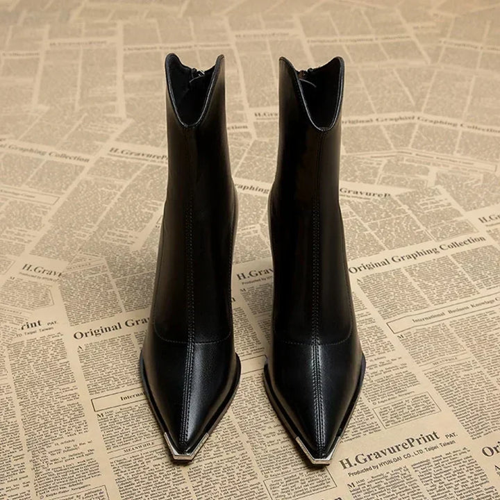 Side profile of women's black pointed heel ankle boots, a chic and trendy option for spring fashion.