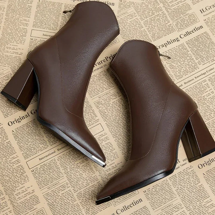 Women's pointed heel ankle boots styled with casual spring attire, showing their versatile appeal.