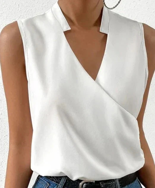 Elegant black sleeveless women's top, flattering fit, highlighting shoulders, ideal for casual or formal occasions.