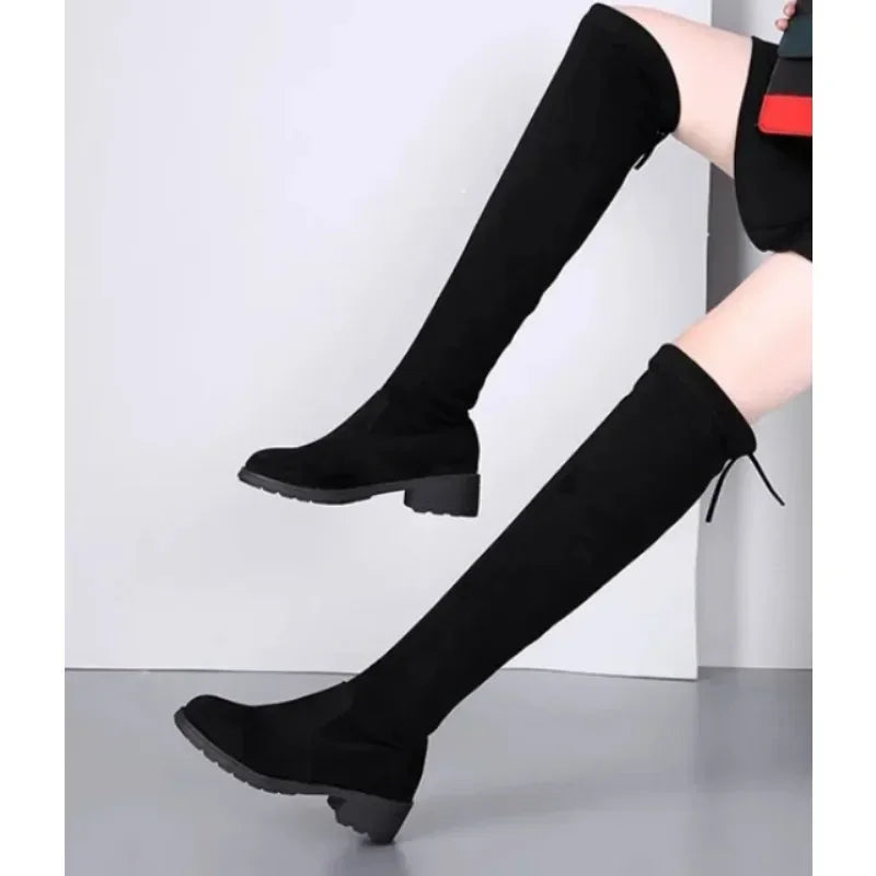 Fashionable women's tall boots in black leather, featuring a comfortable block heel, ideal for chic party wear.