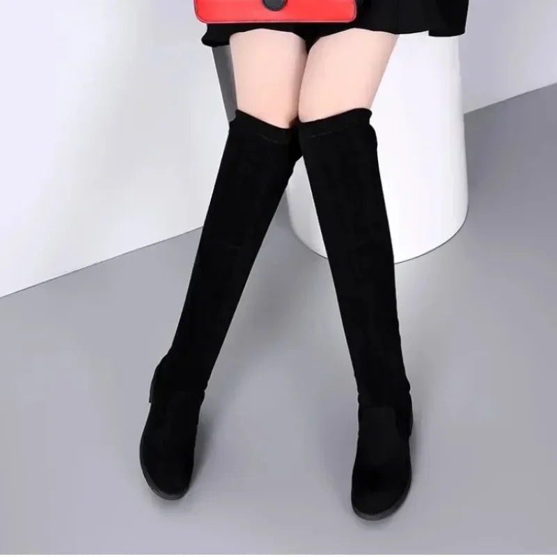 Sophisticated black thigh-high block heel boots for women, excellent footwear for elegant occasions.