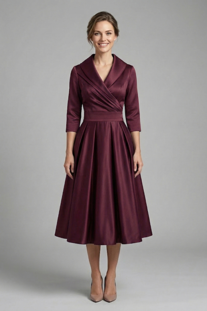 Sophisticated women's blue midi dress, wrap neck, long sleeves. A comfortable and versatile elegant outfit.