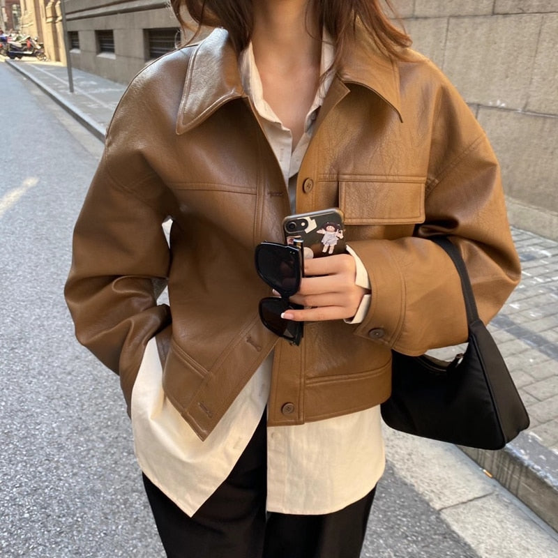Elegant brown cropped women's zip-up jacket, perfect for versatile, stylish outerwear