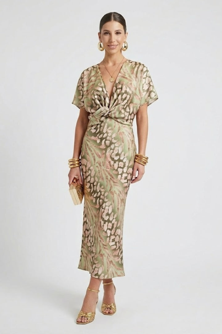 Women's charming green floral midi dress, pleated with V-neck & short sleeves, ideal for parties & daytime events.