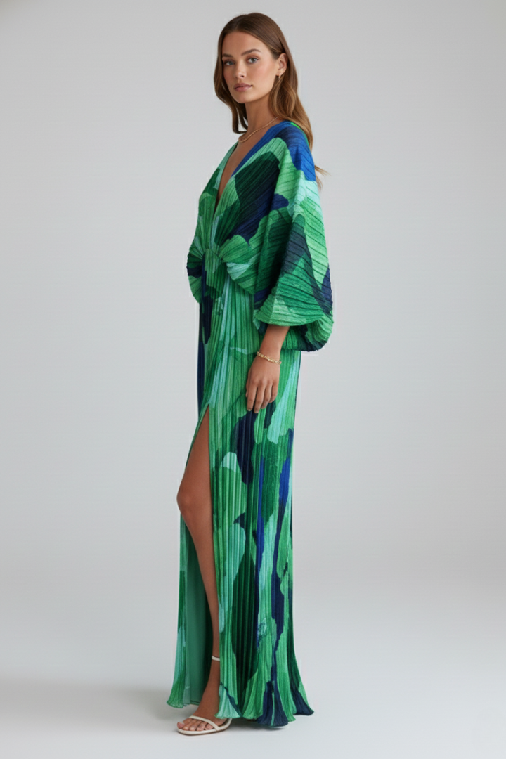 Green elegant women's V-neck dress, featuring a flowing pleated skirt and versatile long maxi length.