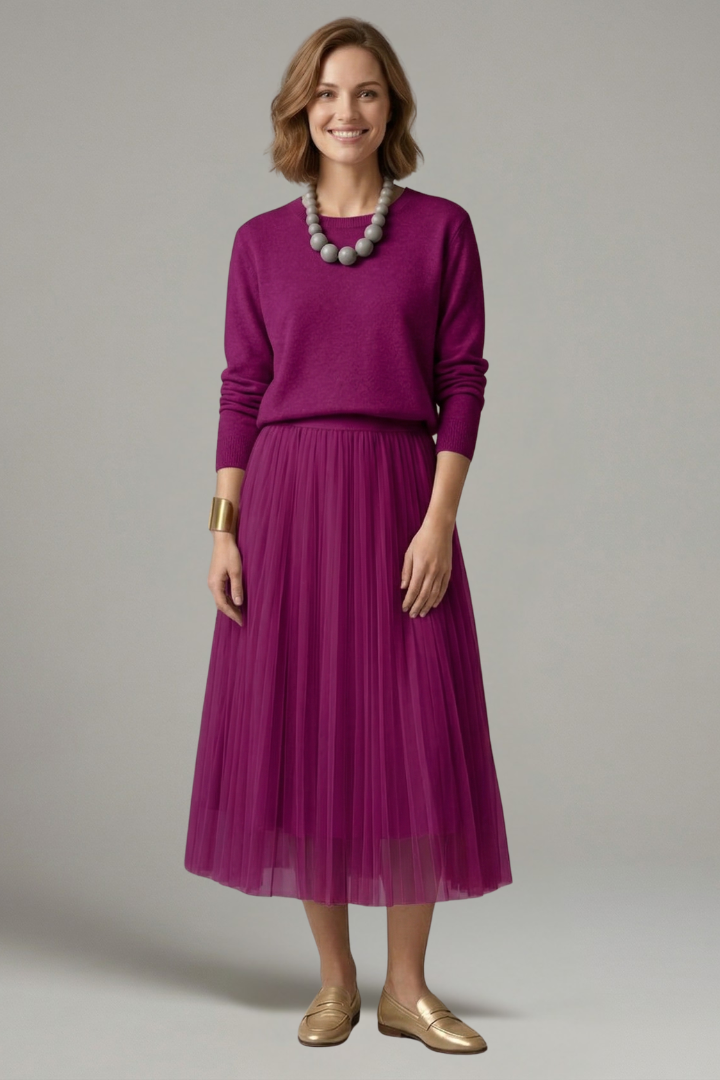 Women's elegant midi dress with pleated skirt, round neck, long sleeves. A versatile autumn/winter fashion piece.