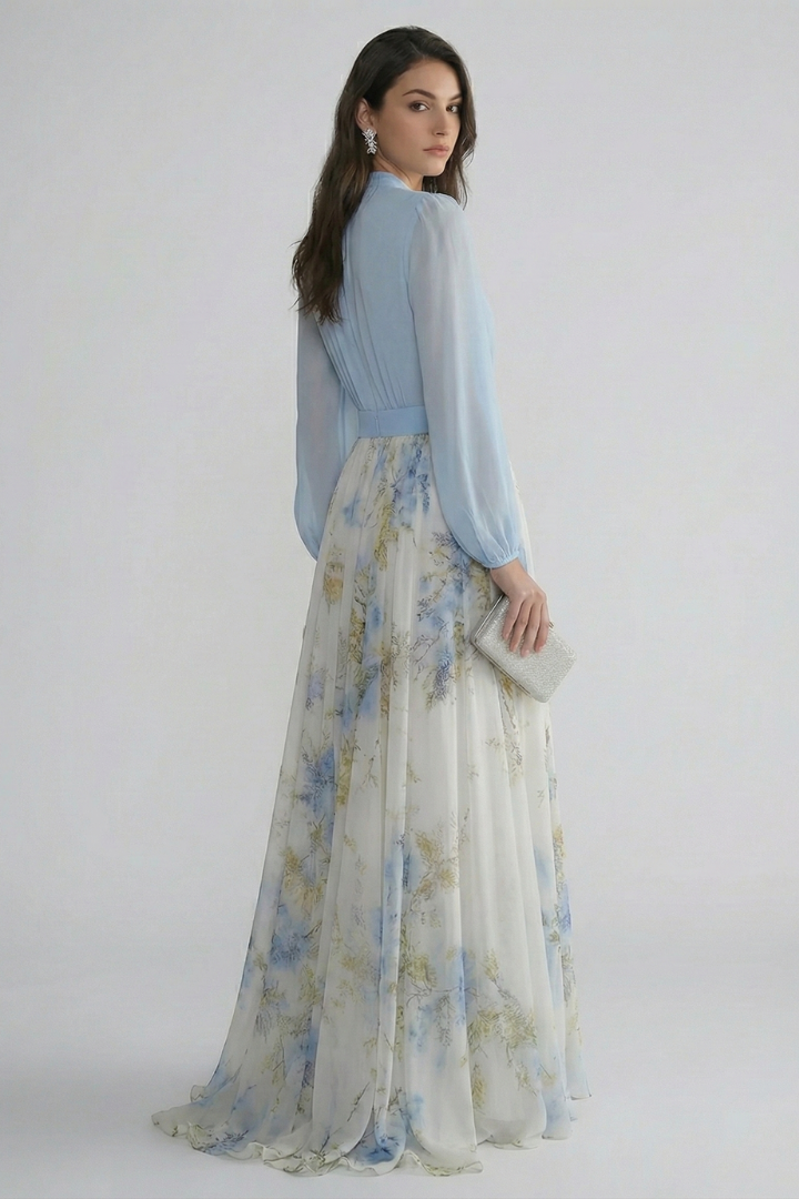 Women's light blue maxi dress, elegant and flowing, with a flattering V-neckline and sheer sleeves for special occasions.