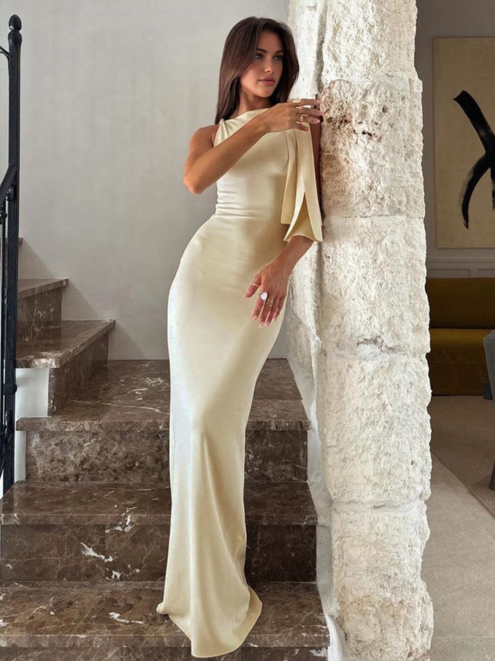 Women's one-shoulder off-white maxi dress, featuring a flowing chiffon fabric, perfect as an elegant summer dress.