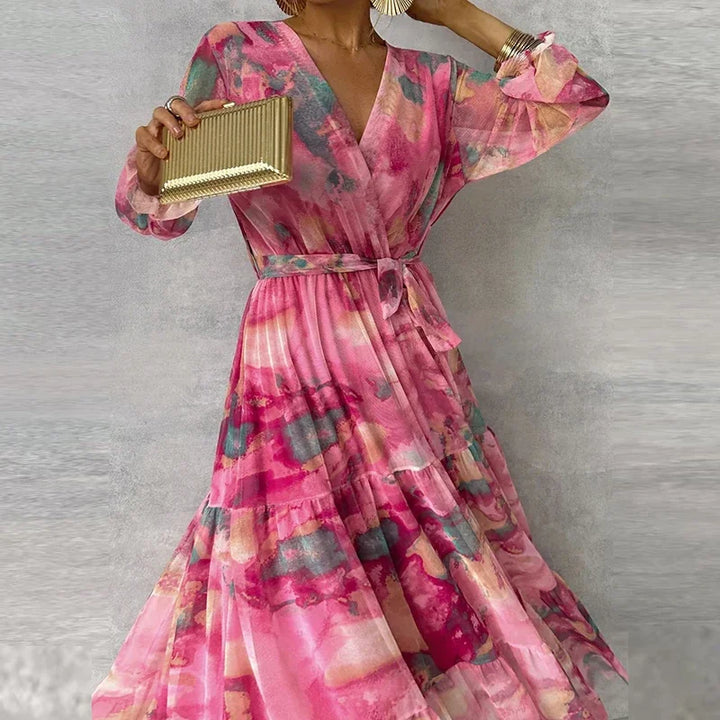 Stylish women's summer party dress: pink floral wrap maxi with V-neck, long sleeves & elegant tiered skirt.