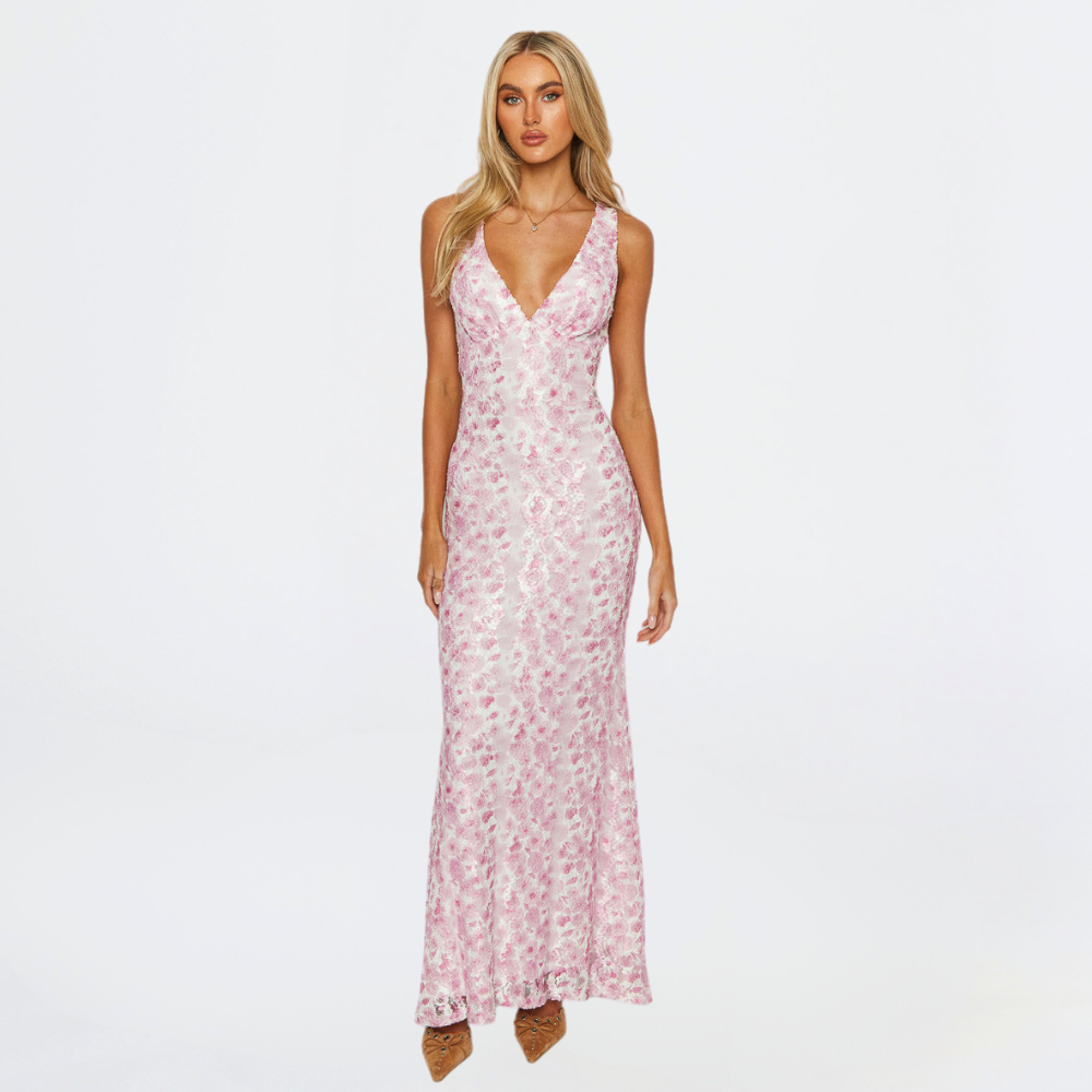 Elegant pink maxi dress, perfect for wedding guests, with a flowing skirt and flattering silhouette