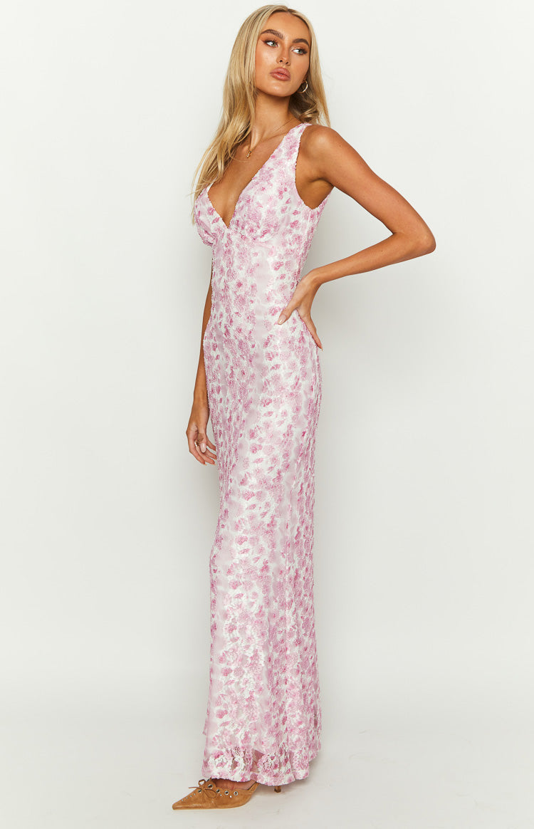 Close-up of the delicate fabric and detailing of a pink women's special occasion maxi dress