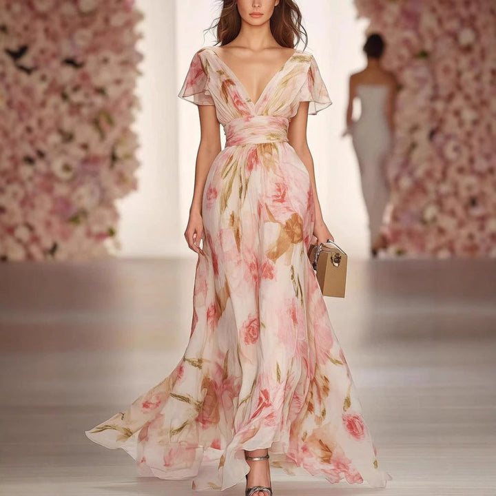 Elegant pink women's flutter sleeve fit & flare maxi dress, perfect for summer, parties, or vacation.