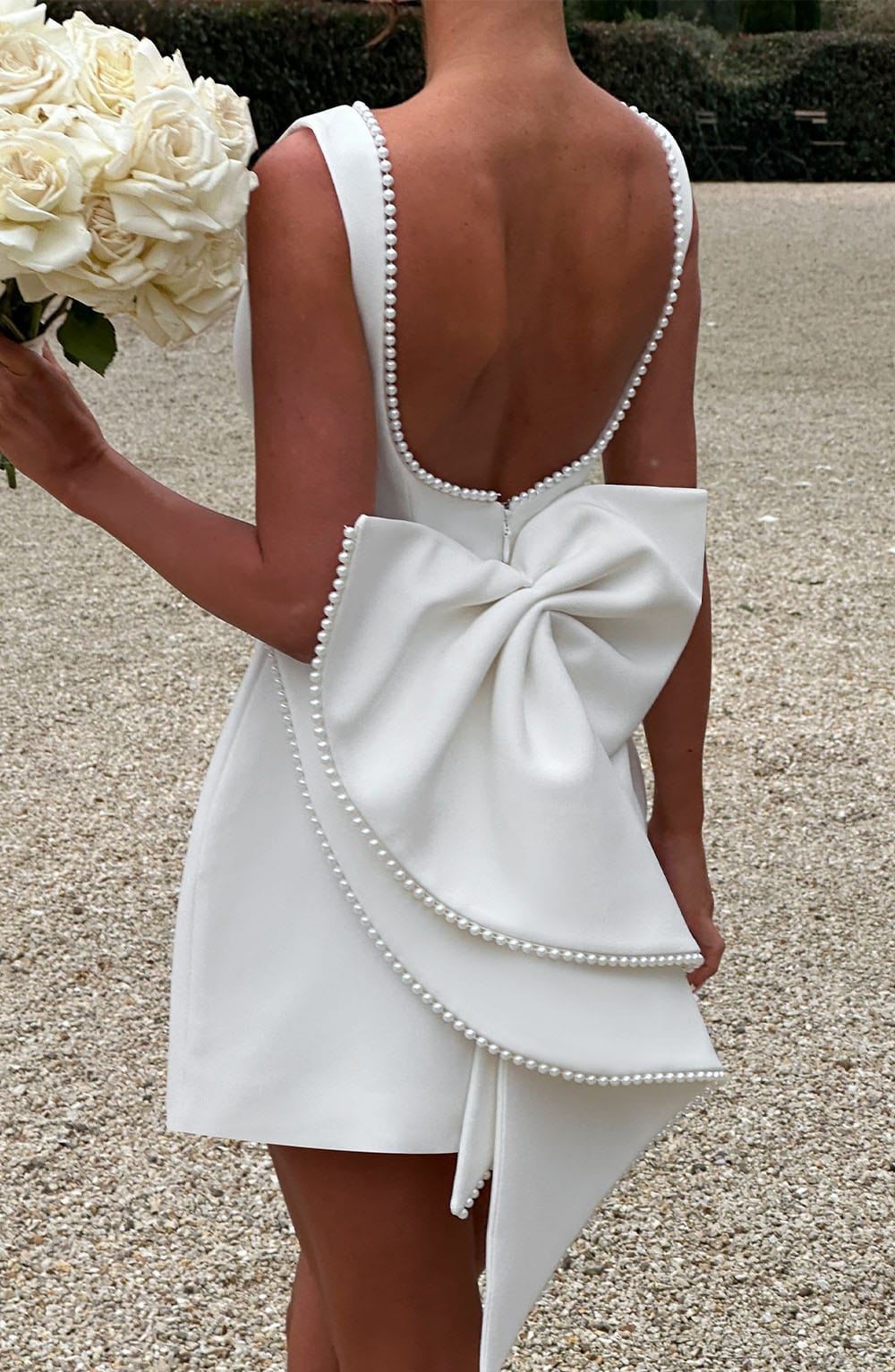 Stylish structured mini dress for women, an elegant and tailored option for special events.