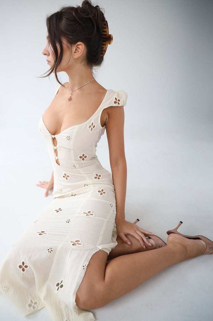 Stylish white midi dress for women, an elegant choice for evening and special occasion wear.