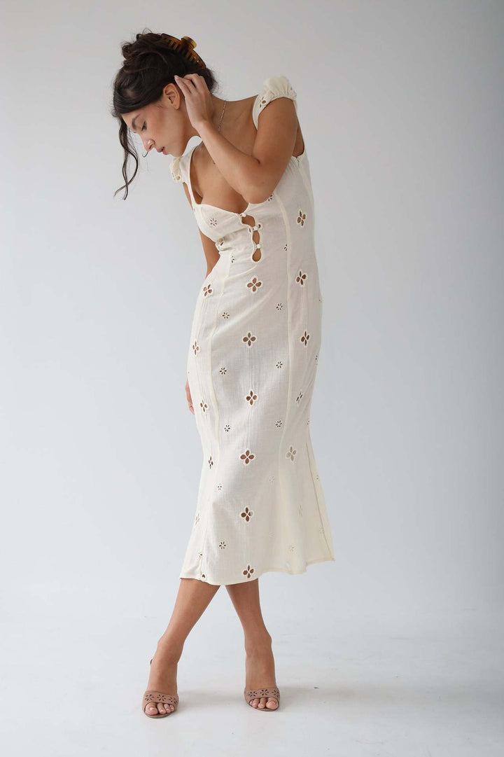 Formal white midi dress, a sophisticated option for wedding guests and celebratory events.