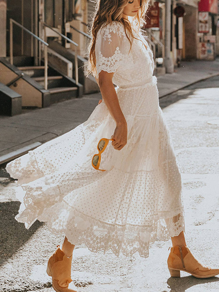 Boho chic women's V-neck A-line midi dress in white, elegant and flowing, ideal for summer and special occasions.