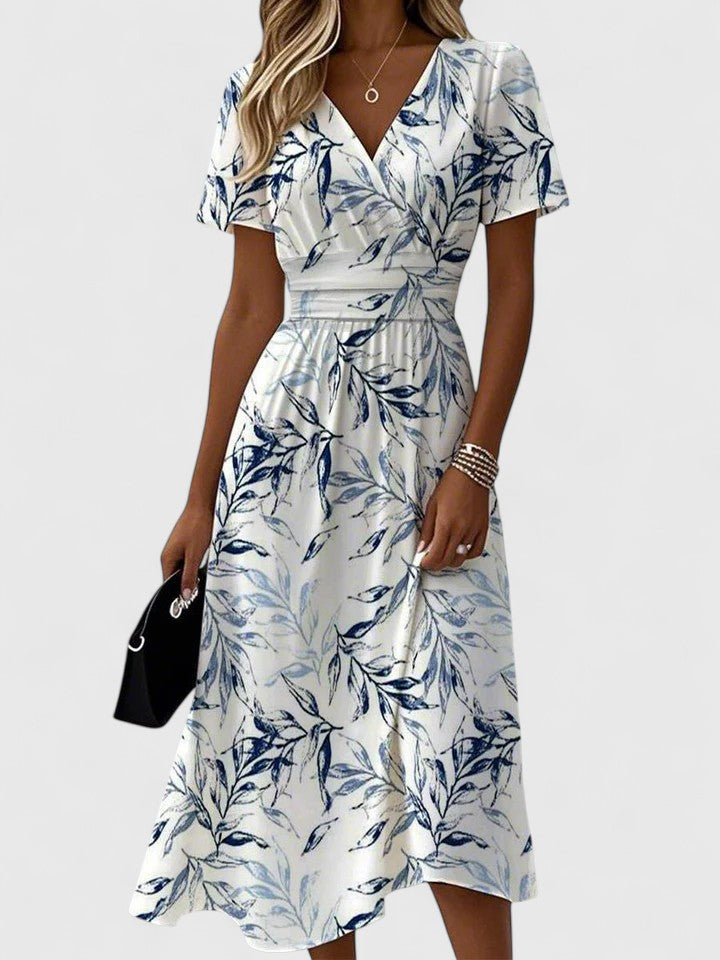 Elegant white V-neck maxi dress for women, perfect for summer events or casual chic. Flowy and comfortable style.