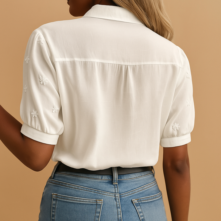 Sophisticated white button-up blouse for women. Classic collar design makes it perfect for office & elegant professional attire.
