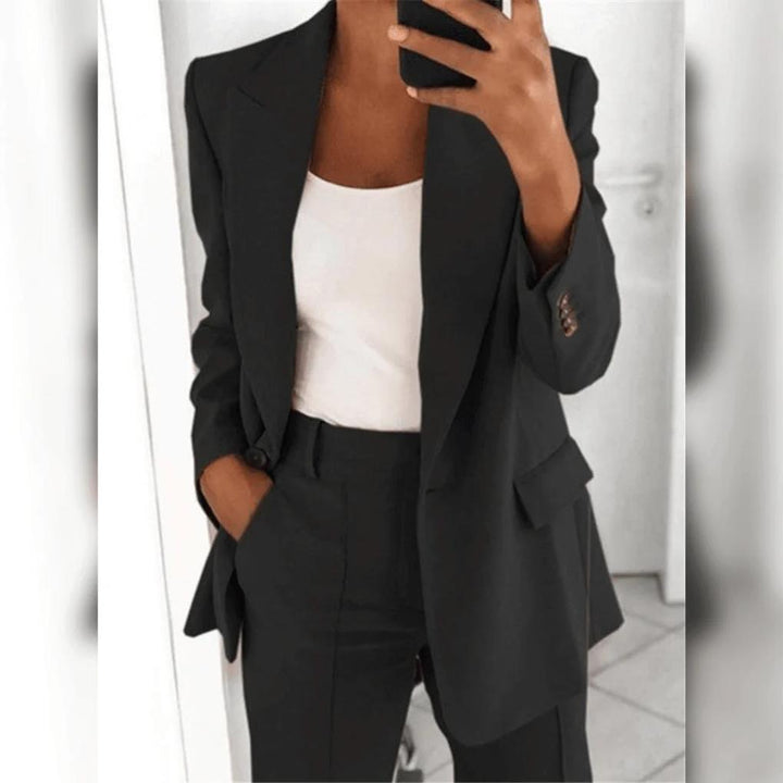 Professional women's tailored blazer, part of a chic 2-piece suit, ideal for formal business & workwear.