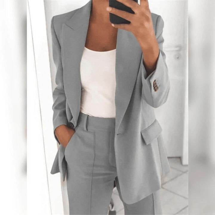 Chic women's office wear 2-piece suit, featuring a stylish blazer and comfortable professional trousers.