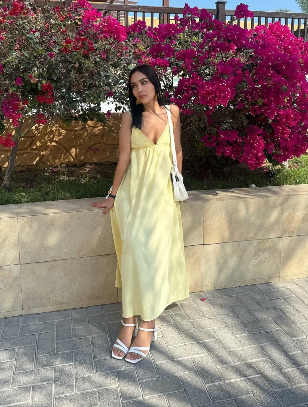 Flowy women's backless maxi summer dress with spaghetti straps, available in white & yellow.