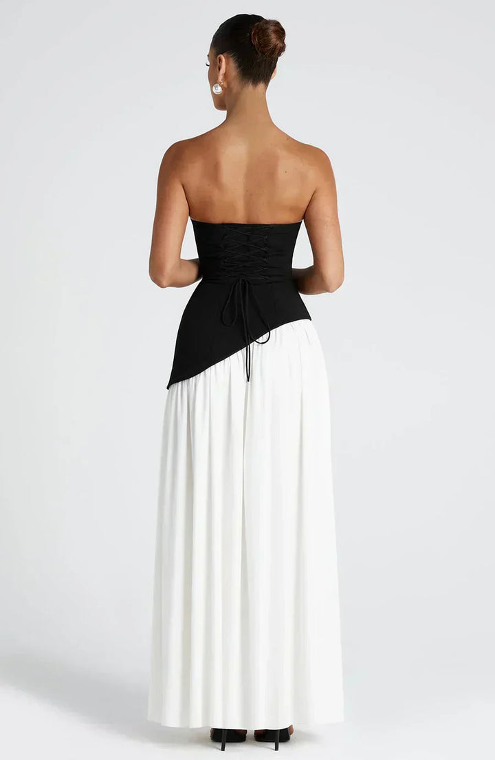 Women's white asymmetric maxi dress, elegant and modern; a formal option for a wedding guest or evening.