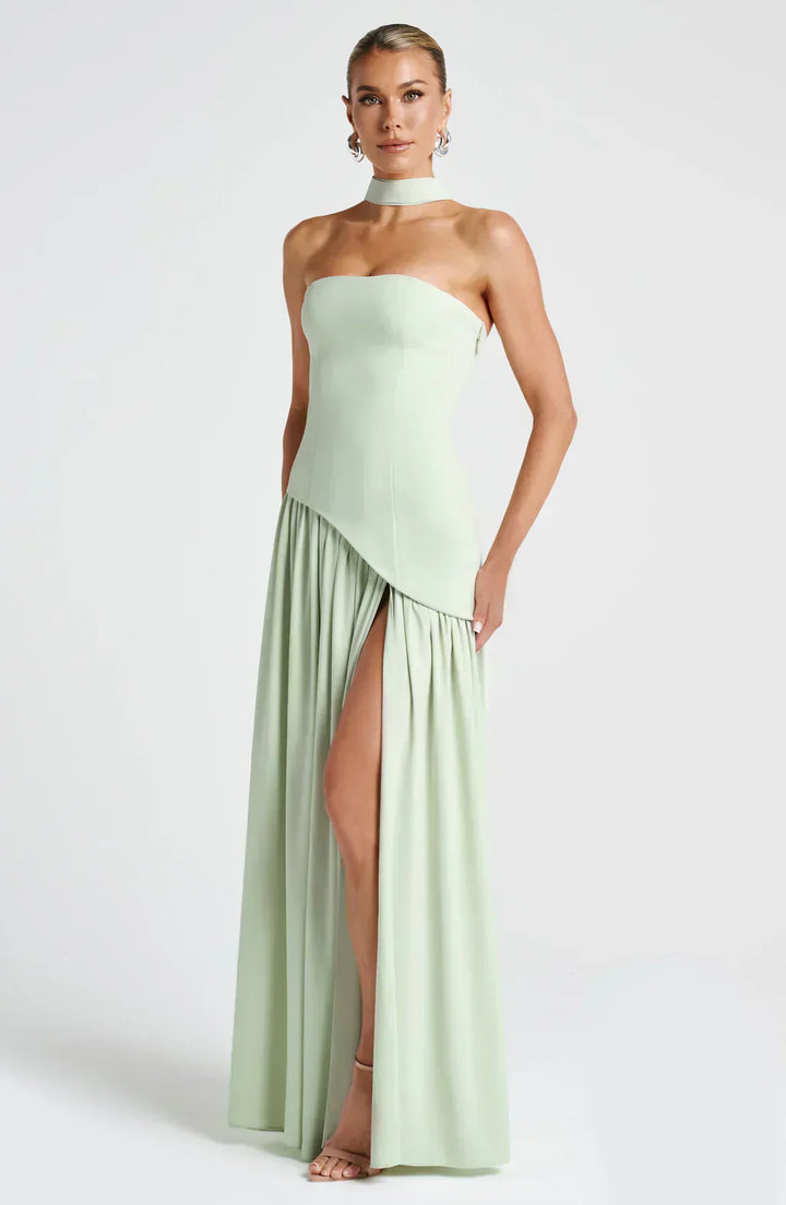 Close-up of the fabric texture on an elegant women's asymmetric maxi dress, evening wear, wedding guest.