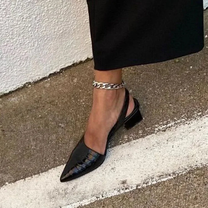 Stylish women's high heel pumps with a comfortable block heel, ideal for versatile fashion.