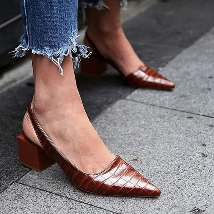 Classic elegant women's pumps in a neutral color, suitable for formal footwear and spring shoes.