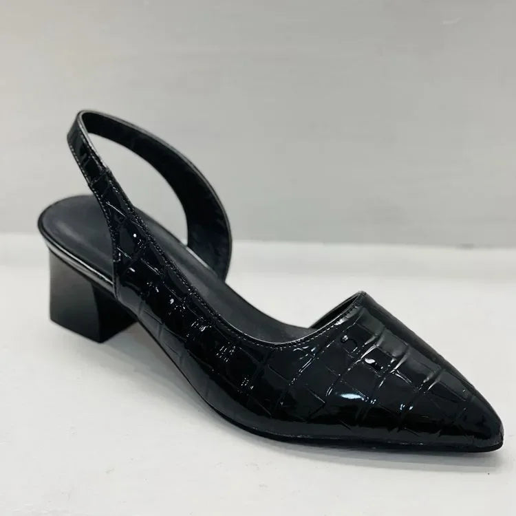 Close-up of a women's block heel pump, highlighting the comfort heel and sophisticated design.