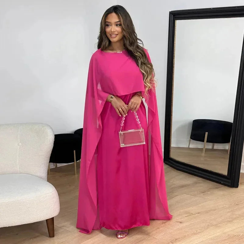 Sophisticated navy blue cape maxi dress for women, ideal for a wedding guest or special occasion.