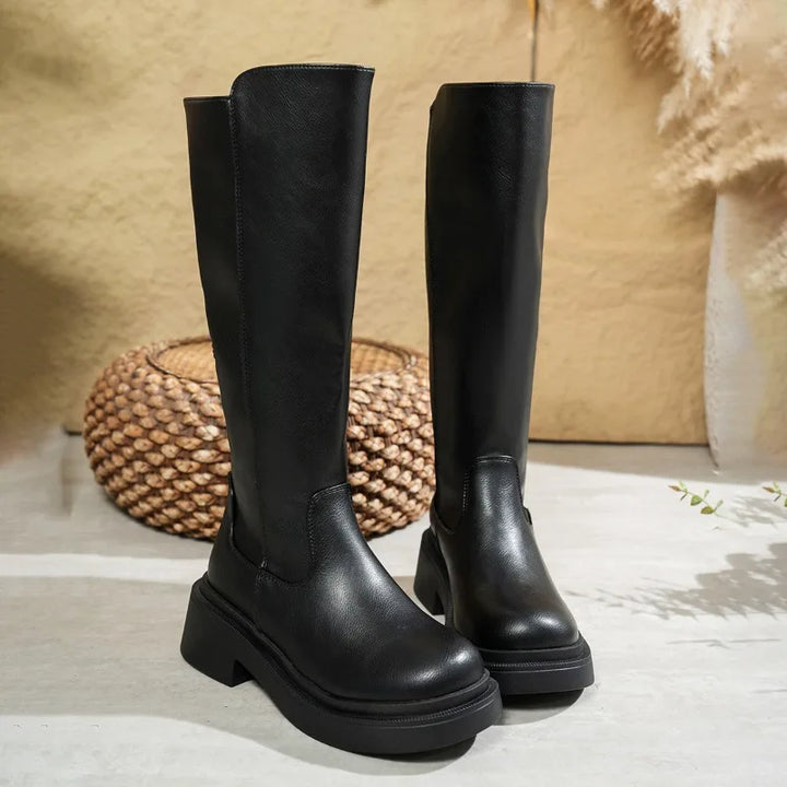 Fashionable women's knee-high boots crafted from premium leather, featuring a comfortable block heel.