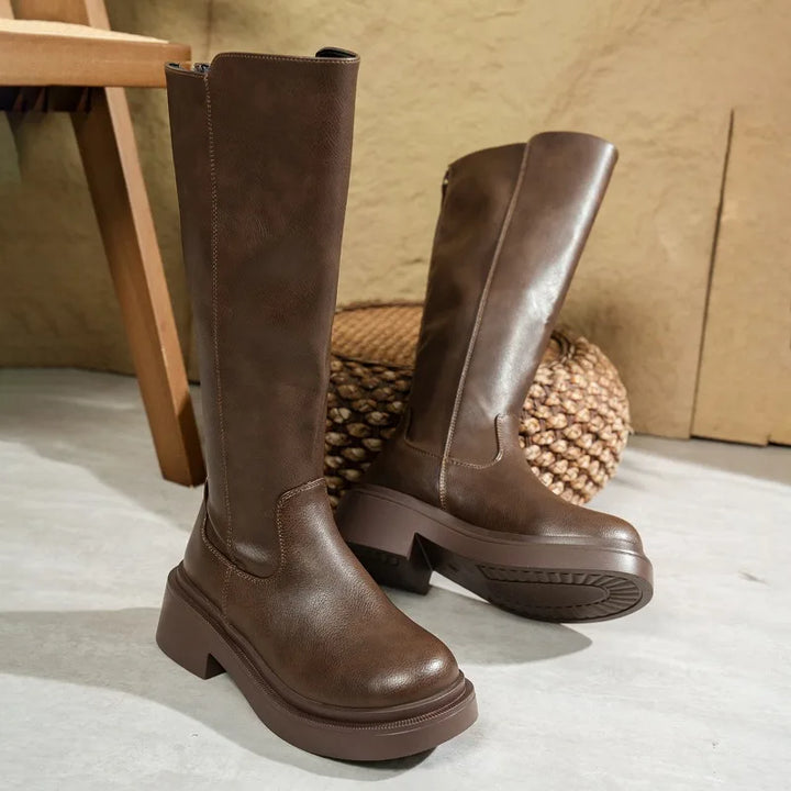 View of women's heeled knee-high leather boots, designed for both comfort and elegance in winter.