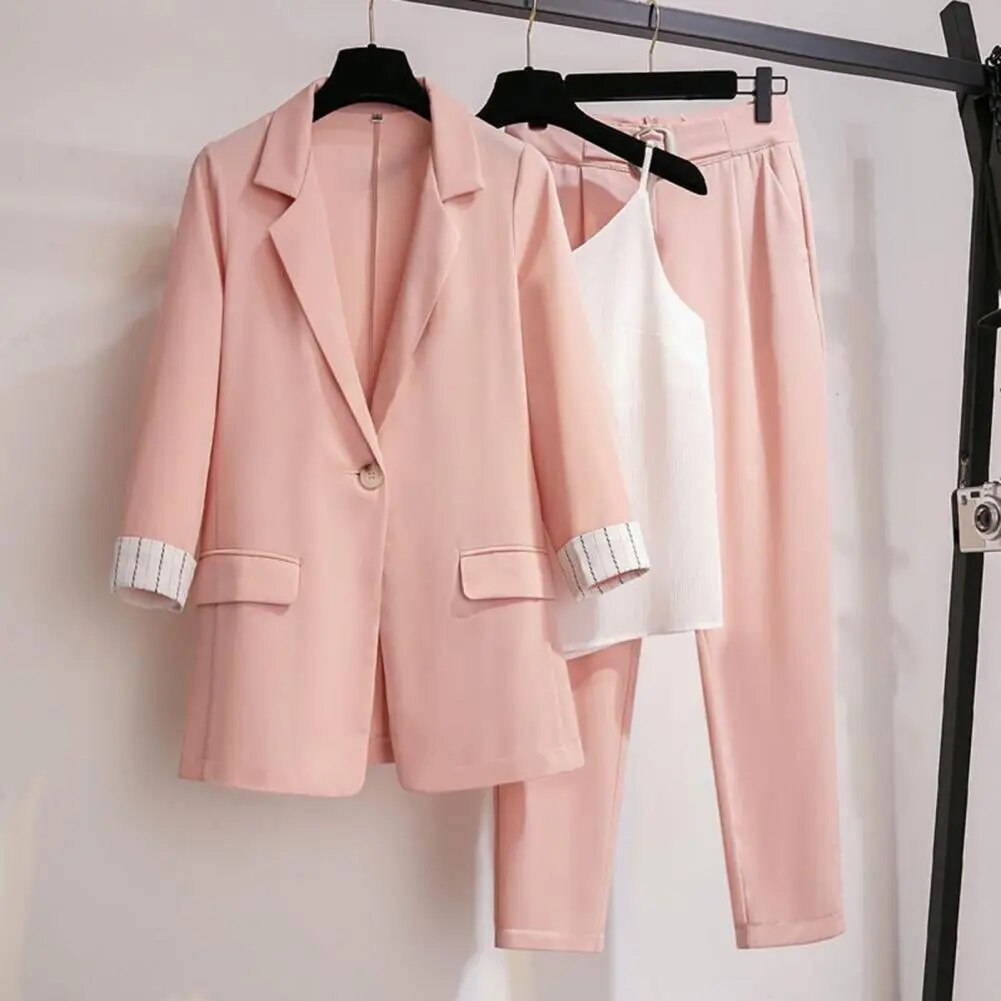 Complete women's suit set: a classic blazer, comfortable pants, and a sleeveless top, ideal for work