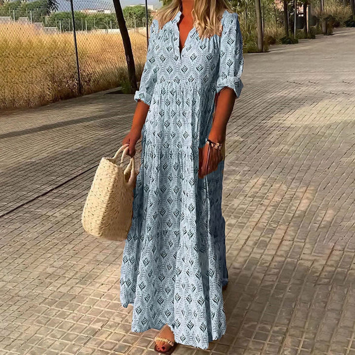 Flowing women's bohemian maxi dress with a flattering V-neck, long sleeves, and a unique print for casual wear.