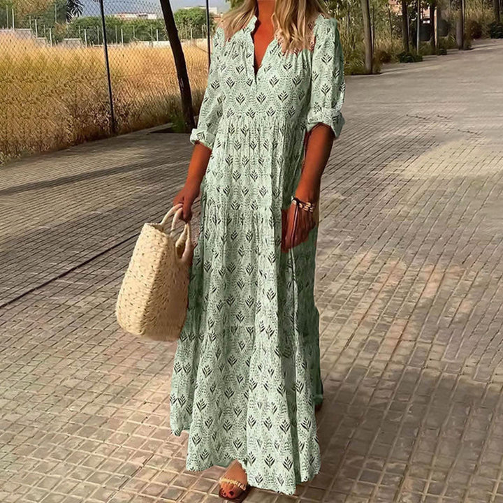 Women's elegant boho maxi dress with adjustable long sleeves and a stylish all-over print, perfect for casual outings.