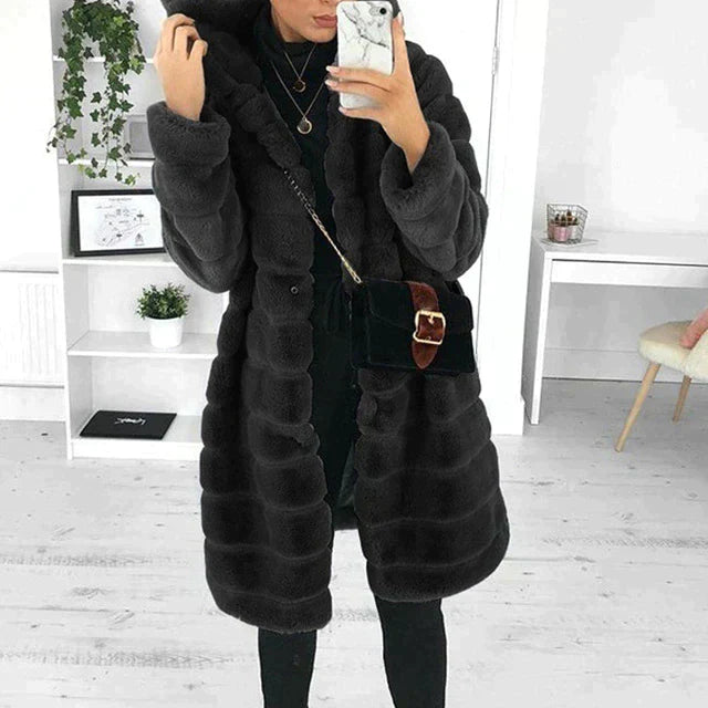 Warm women's outerwear: a chic button-down faux fur coat, perfect for elegant winter fashion.
