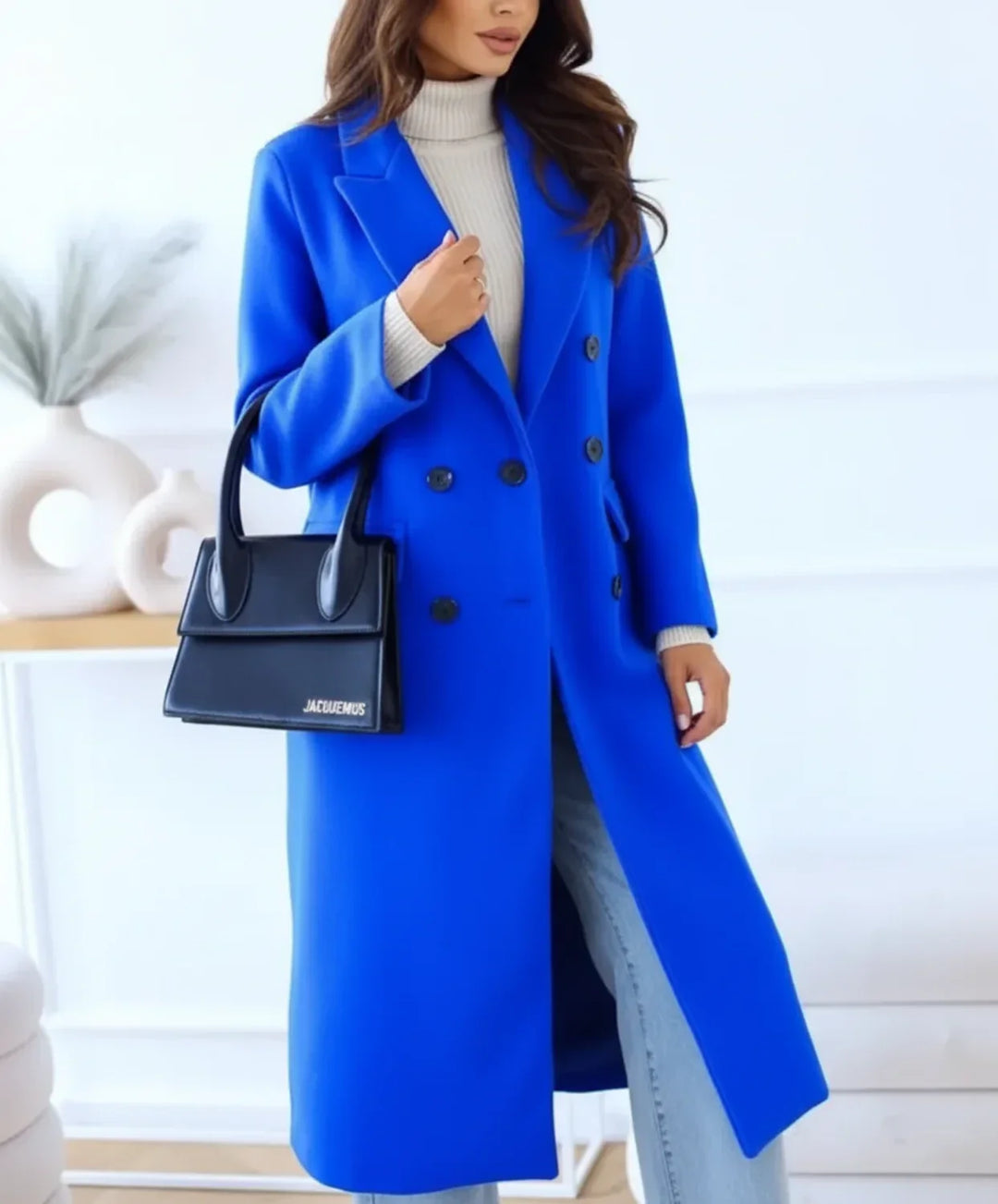Elegant women's classic black double-breasted long winter coat with notch lapel and stylish buttons, for fall fashion.