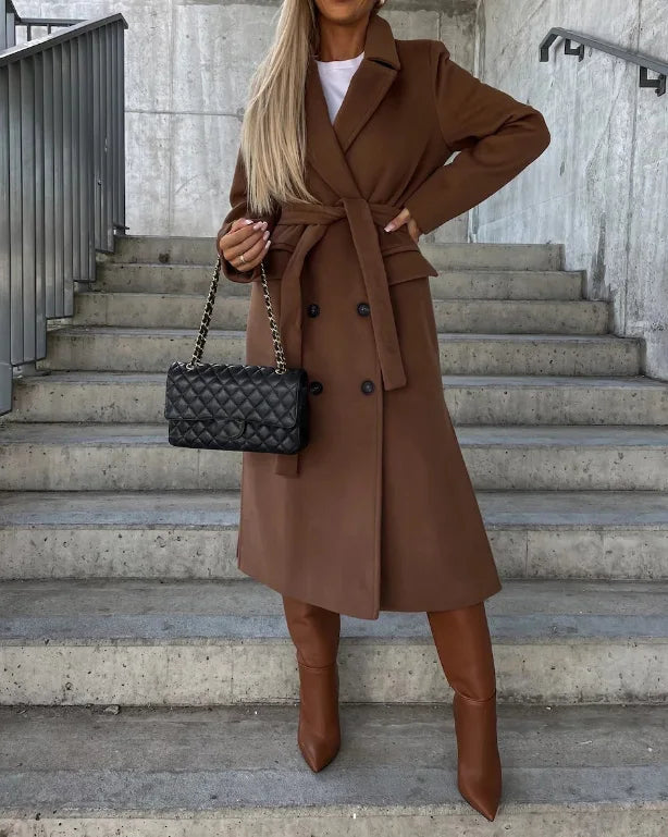 Close-up of a women's classic long sleeve trench coat showcasing its fabric and design