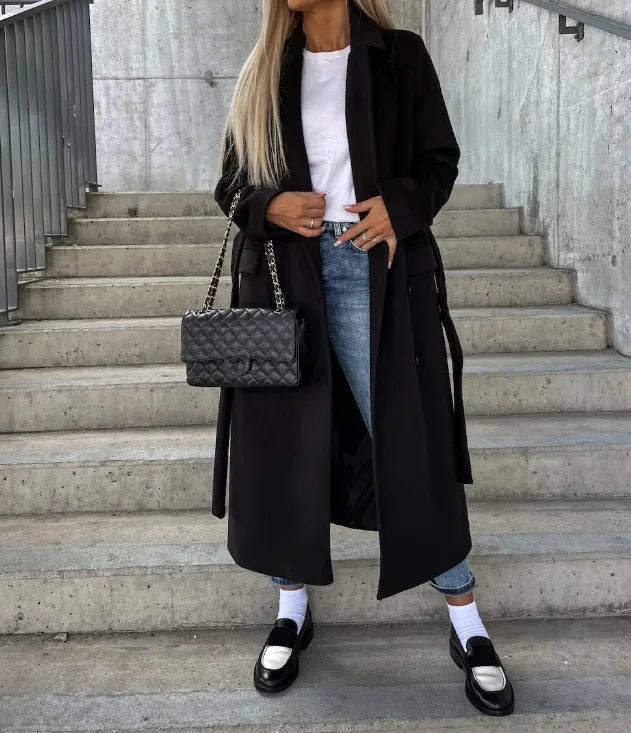 Model wearing a women's classic long sleeve trench coat, highlighting its elegant fit and style