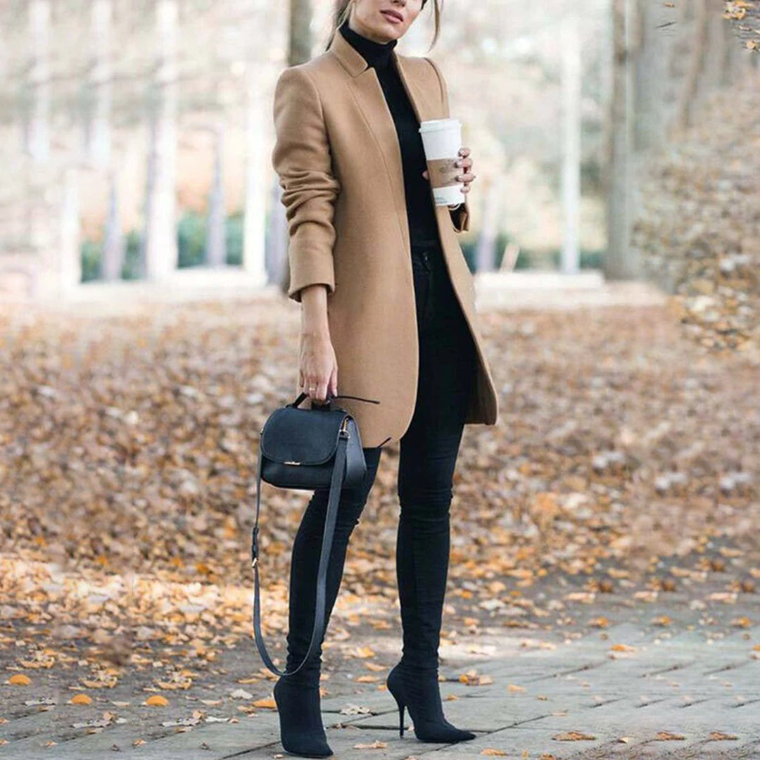 Elegant women's classic tailored lapel winter coat in a neutral color, perfect for cold weather fashion.